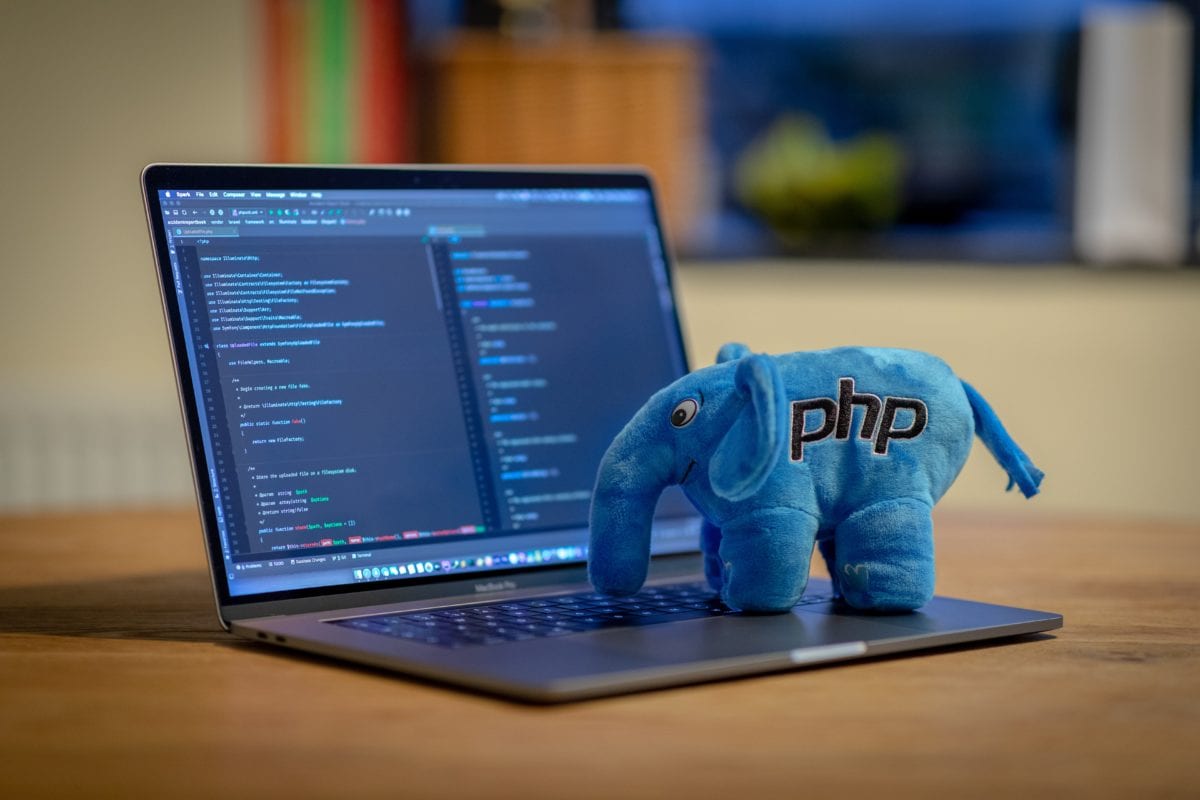 PHP Plush Elephant on a Macbook Pro, with PHP Storm running on it.